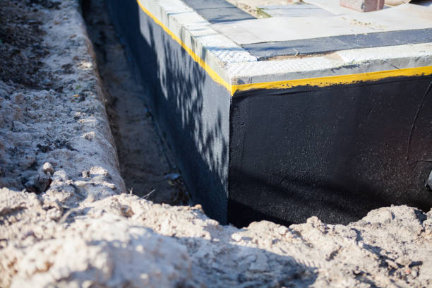 Professional Basement Waterproofing technician working in Marietta, NY